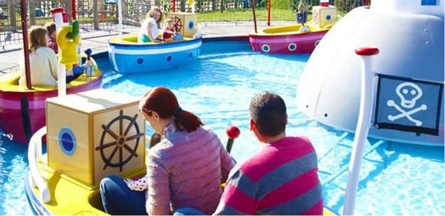 A picture of guests enjoying Grandpa Pig's Boat Trip, which is a water ride.