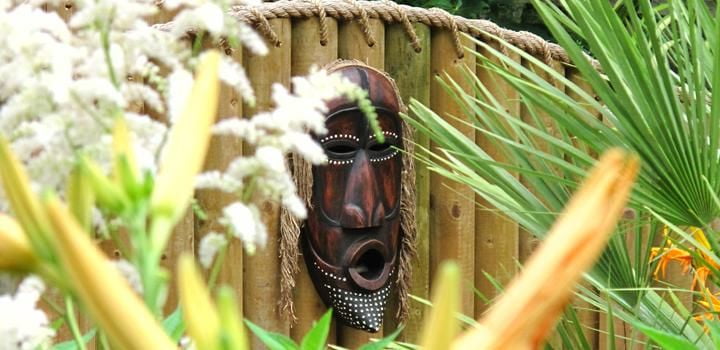 An African-themed mask in the Jungle Falls garden